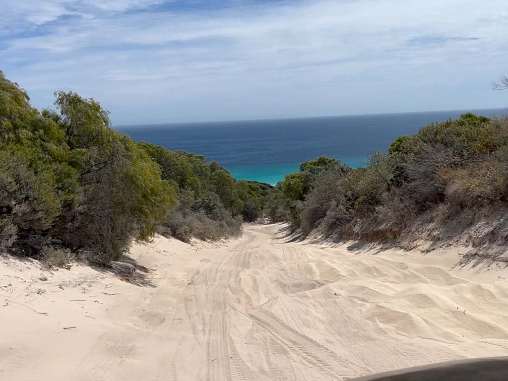 Sandy road to Boranup Beach on Bob's Track in black 4WD.