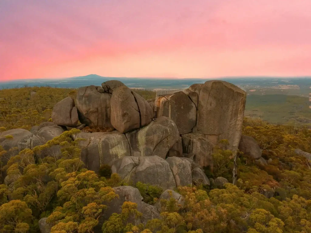 The porongurup ranges under an orange and pink sky in the great southern region of Western Australia