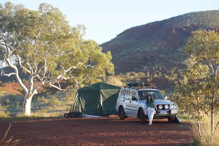 Tent and four wheel drive camping set up at Albert Tognolini Rest Area in Karijini National Park overlooking Mount Bruce