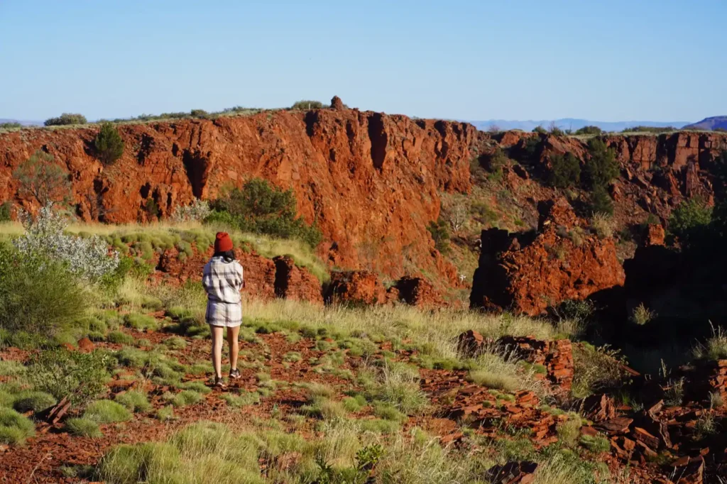 Female hiker on top of Mount Bruce in Karijini National Park