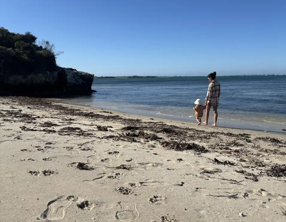 Woman and child walking on Point Peron's many beaches in Rockingham WA.