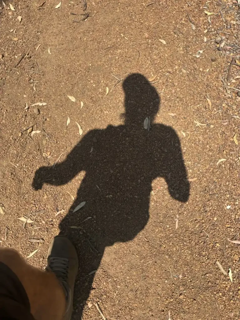 tough hikes in perth Shadow of hiker on tough Perth trail.